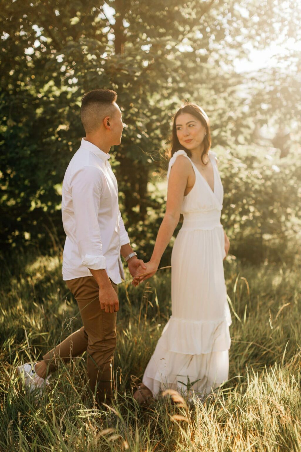 Engagement photos for a couple at discovery park in seattle at golden hour