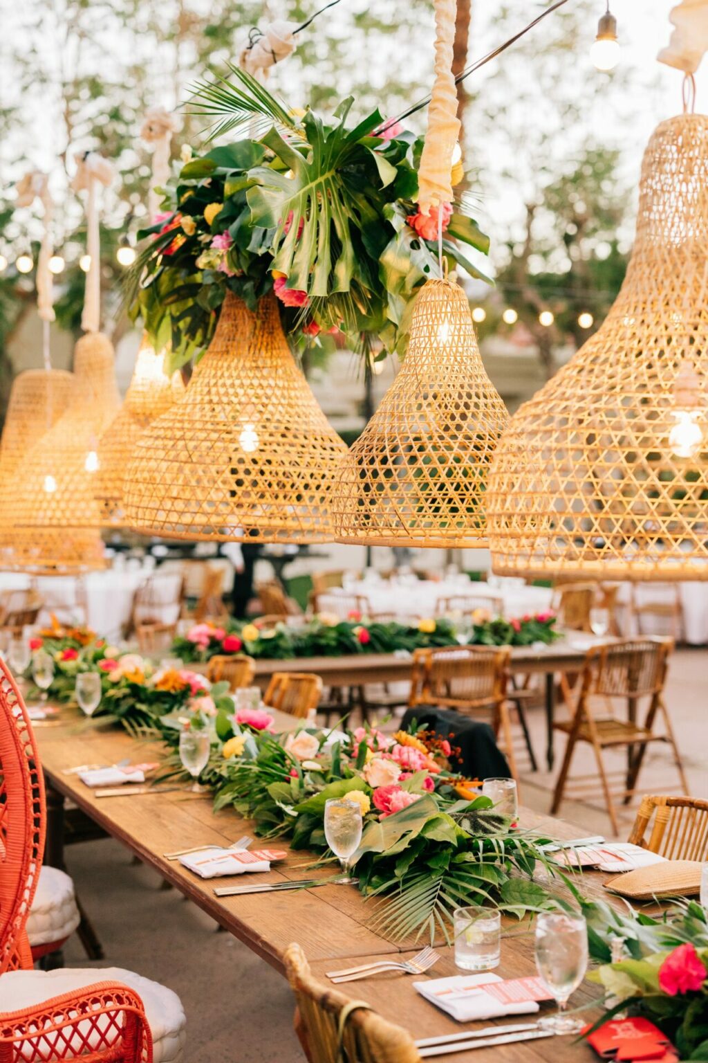 Bohemian wedding reception decor with hanging latterns and palm fronds in palm springs