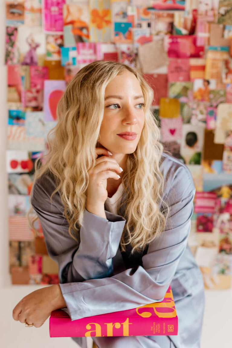 a business woman poses for head shots in a studio