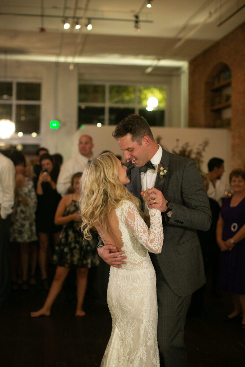 Axis Pioneer wedding reception in Seattle bride and groom dancing