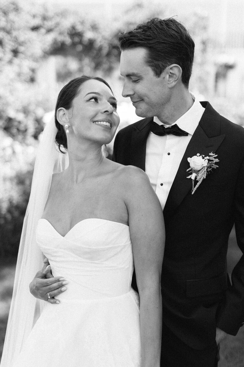 A classic black and white image of a bride and groom on their wedding day at Roche harbor shot by a Los Angeles wedding photographer