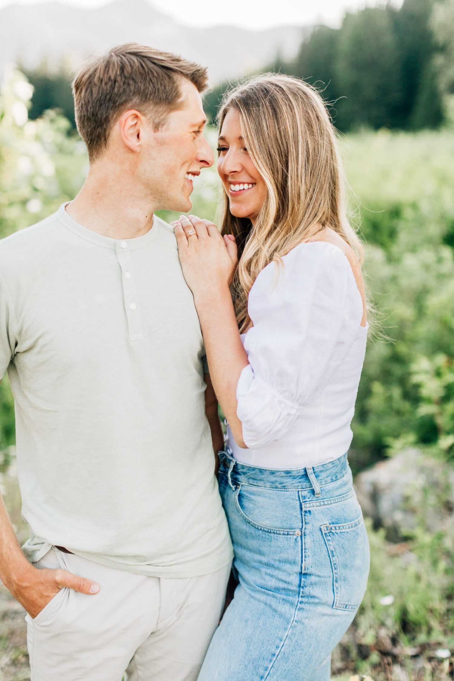 Engagement session by a lake with a happy couple at sunset in Seattle, photographed by a los angeles wedding photographer